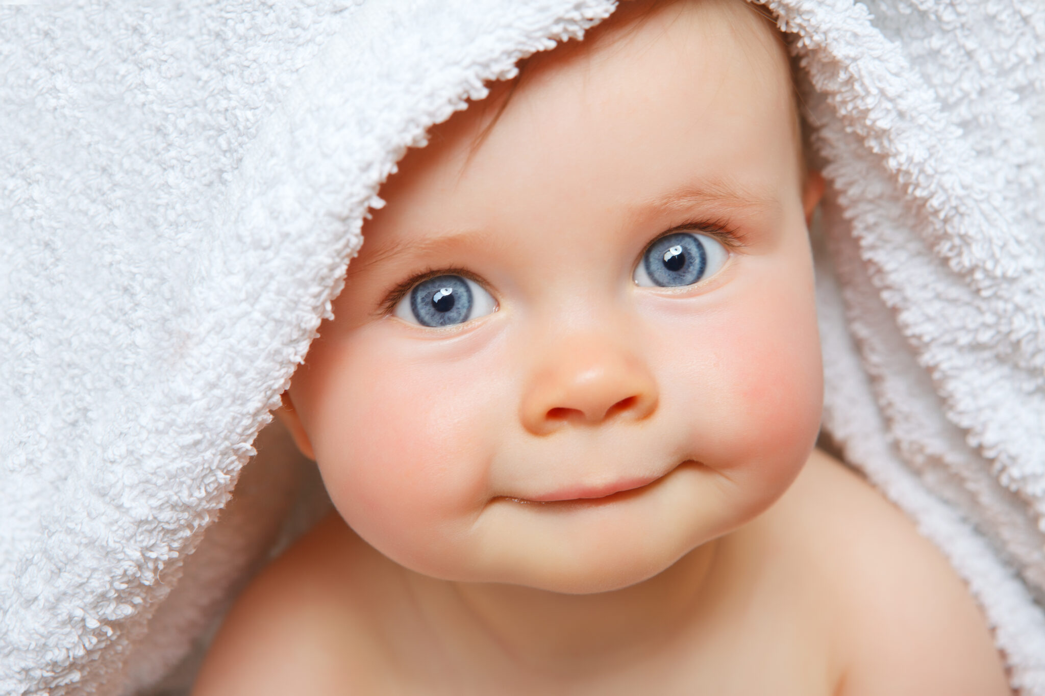 baby under a towel